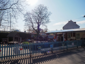Exterior shot of the Oaks Primary Academy building, showing the outdoor play area.